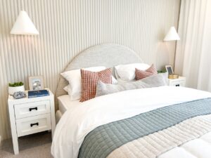 styling your home and create an inviting bedroom sancturay, styled bed and bedside tables in soft neutral tones